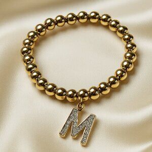 Gold Beaded Stretch Bracelet w/ Colorful Dazzling "M" Charm – Fashion Jewelry